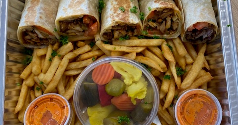 Chicken wraps with fries, pickles vegetables and sauce