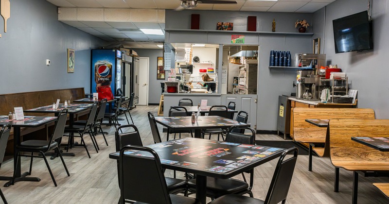 Interior, tables and chairs in dining area