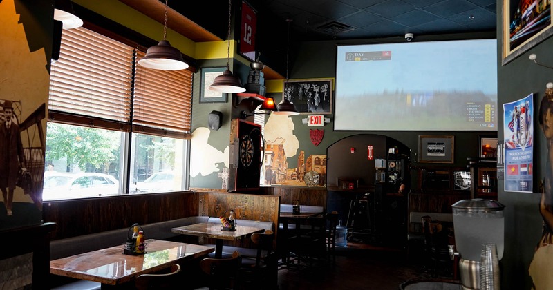 Interior, tables and chairs next to the windows