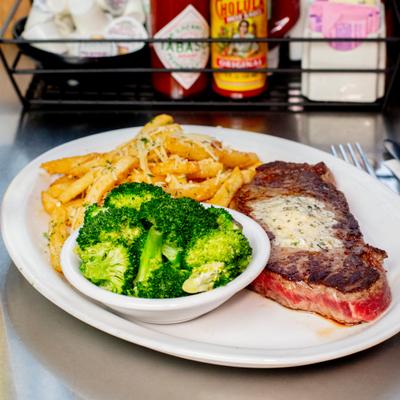 NY steak served with broccoli and fries.