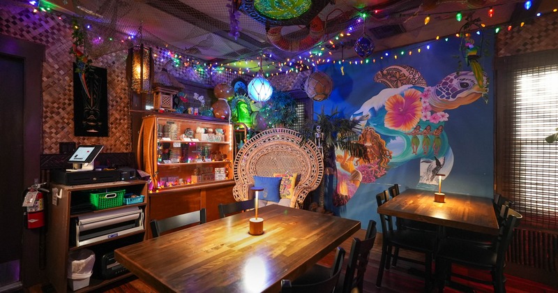 Cozy tropical-themed cafe with wooden tables