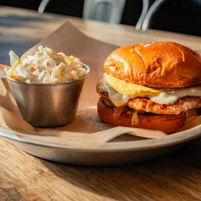 LG Meats Brat Burger and side of coleslaw.
