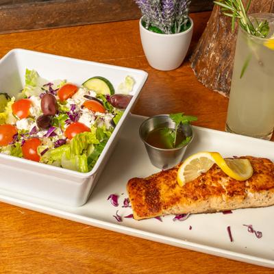 Salmon Filet served with a salad.