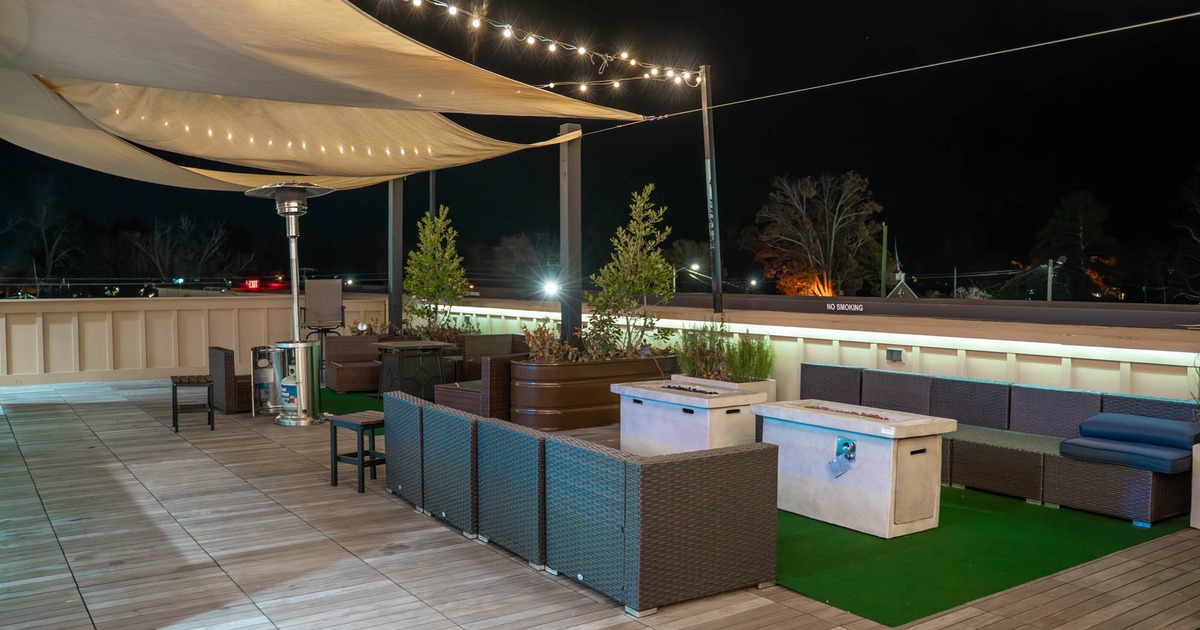 The Wing Company Pembroke, outdoor space and seating area at nighttime