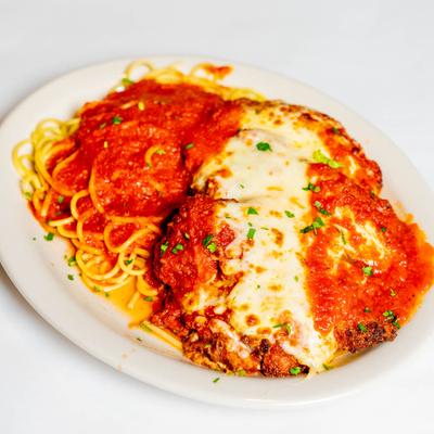 Lightly breaded veal cutlet with tomato sauce, mozzarella, and pasta.