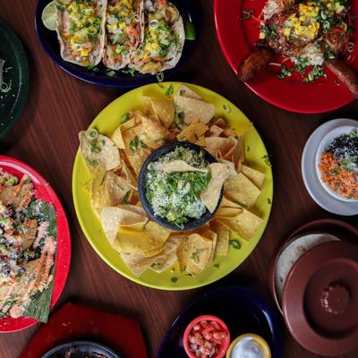 Miscellany of dishes arranged on a table, top view.