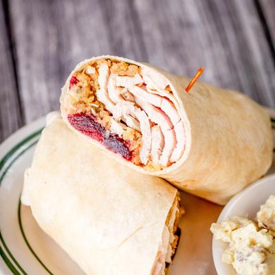 Thanksgiving Wrap white turkey meat, stuffing and cranberry mayonnaise.