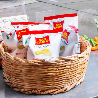 Bags of potato chips in a woven basket.