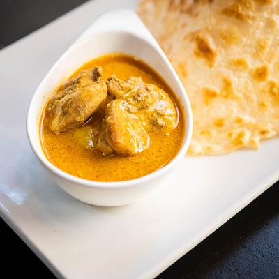 Indian pancake served with a curry sauce.