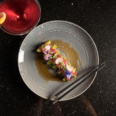 Bluefin Tuna with Ginger Sauce, alongside cocktail.