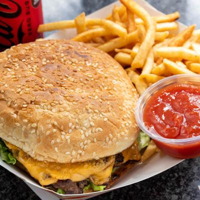Cheeseburger with fries and dipping sauce.