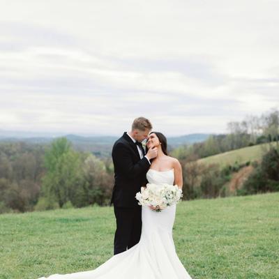 The bride and groom kissing.