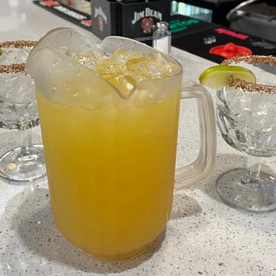 Yellow beverage on the table.