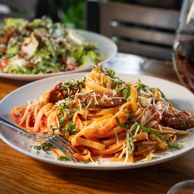Fettuccine Pomodor in front the salad