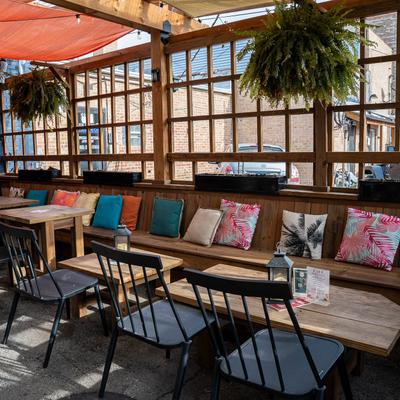 Patio cover, cozy seating area.