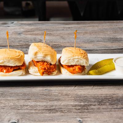 Buffalo Chicken Sliders with ranch or bleu cheese sauce.