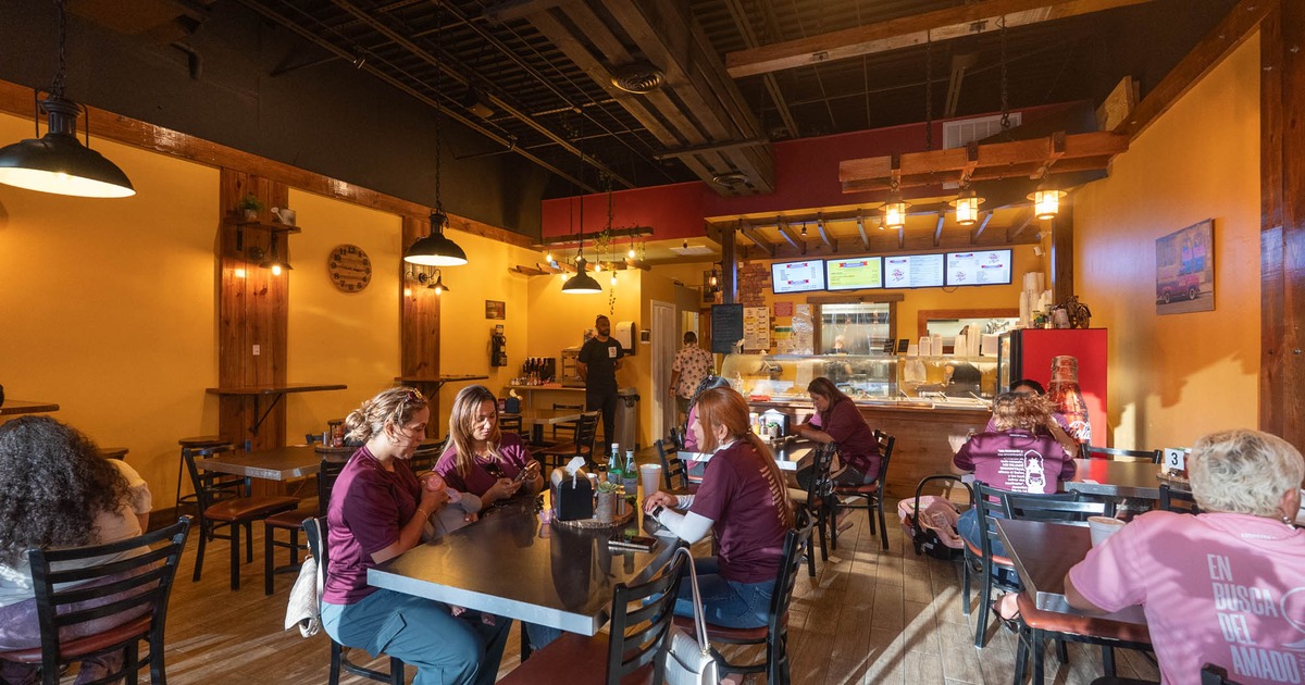 Interior, tables and chairs, guests sitting and chatting