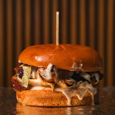 Chicken Burger with lettuce, tomato and sauce.