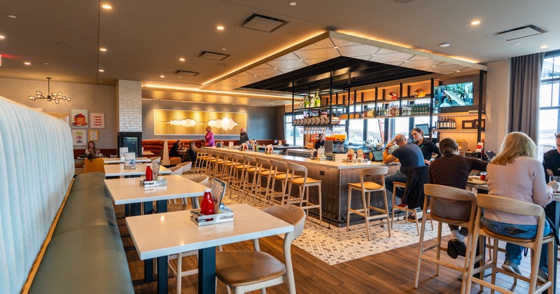 Interior, table and chairs, bar, wide view