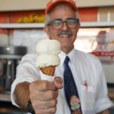 Thad Doumar holding vanilla double dip ice cream cone.