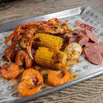 Grilled shrimp, snow crab, and sausage combo meal.