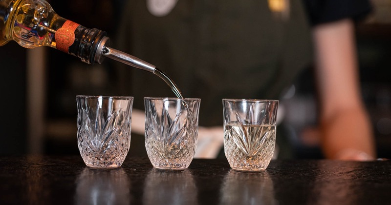 Bartender pouring tequila