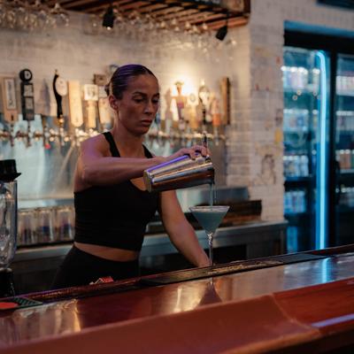 A staff member preparing a drink.