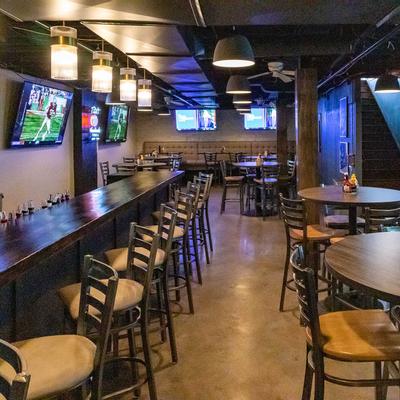 Interior, bar area on the left, tables on the right