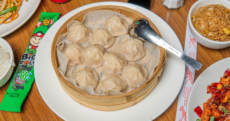 Custard Buns in bamboo basket, served on the table