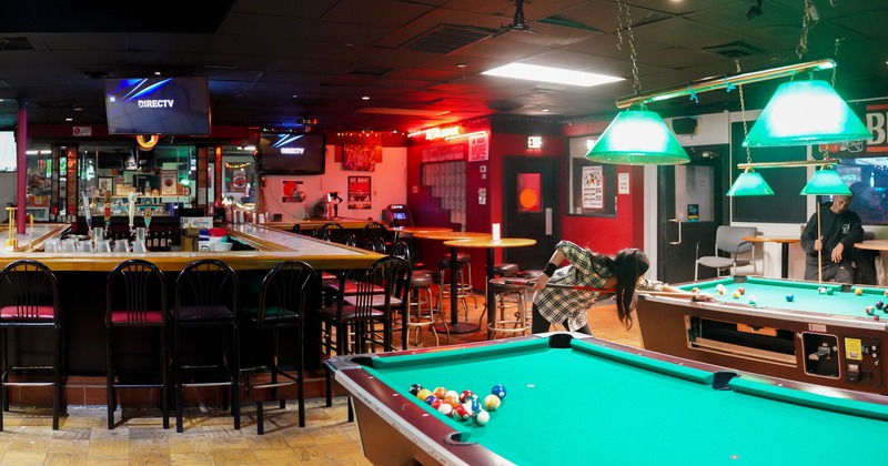 Pool table, bar area behind
