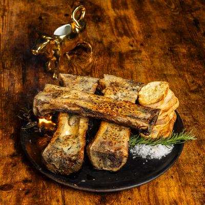 Roasted Bone Marrow accompanied by fire-toasted crostini, sea salt and herbs.