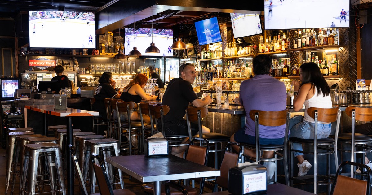 Customers sitting at the bar