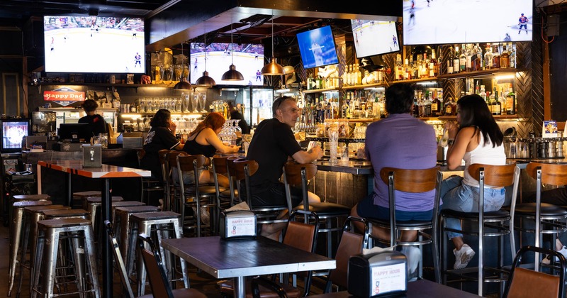 Customers sitting at the bar