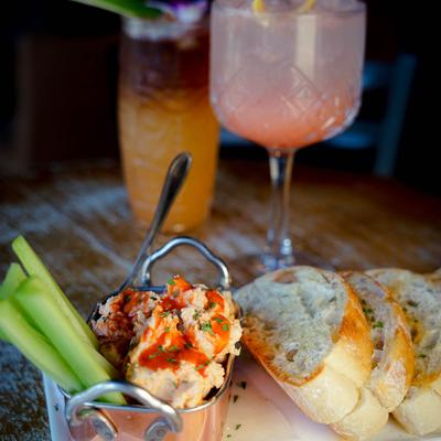 Buffalo grilled chicken and goat cheese dip, served with celery and crostini