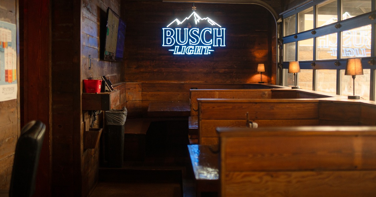 Interior, diner area, wide view, booths, light sign on the wall