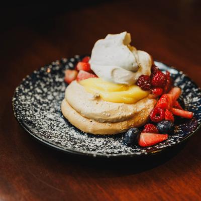 Warm Caramelized Pineapple Tart, with berries and vanilla ice cream.