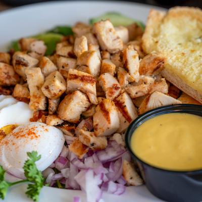 Cobb salad with grilled chicken, bacon, blue cheese crumbles and hard-boiled egg.