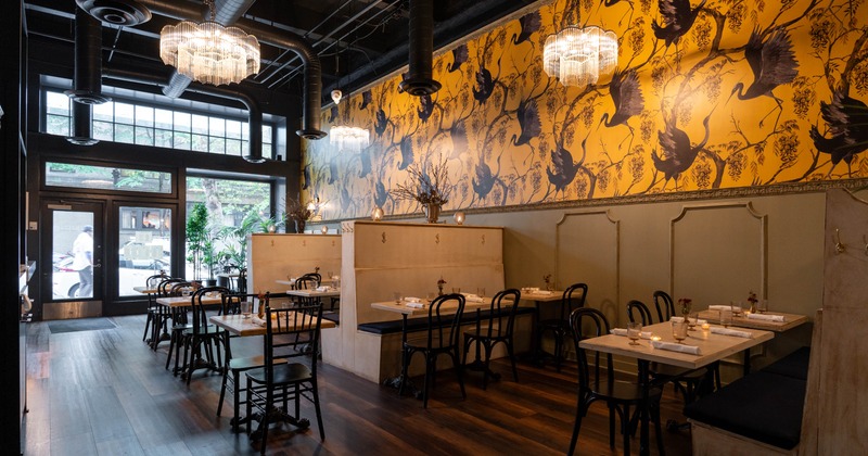 Interior, dining area, banquette benches with tables and chairs, tables for two