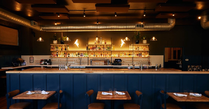 Interior seating area, tables ready for guests