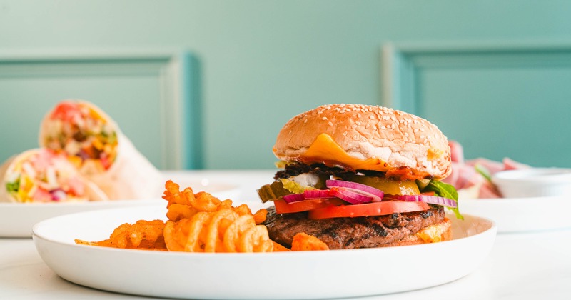 Cheeseburger with bacon, lettuce, tomato, onion, pickle and a side of waffle fries