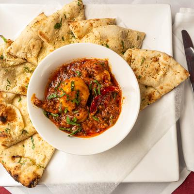 Shrimp Tikka Masala, with naan bread.