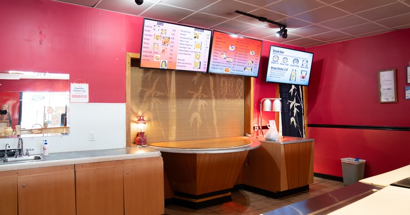 Food counter, tv screens above