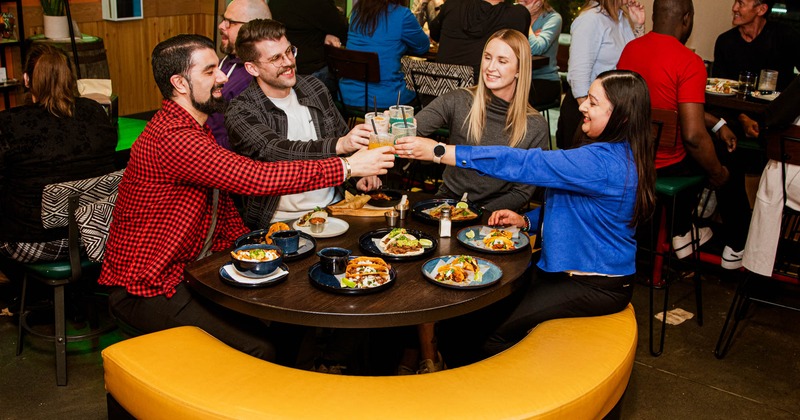 Customers toasting with drinks