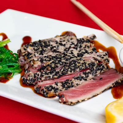 Sesame crusted ahi tuna served with Asian seaweed salad.