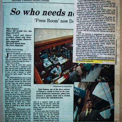 A newspaper article about Dobson's restaurant featuring photos of its busy bar