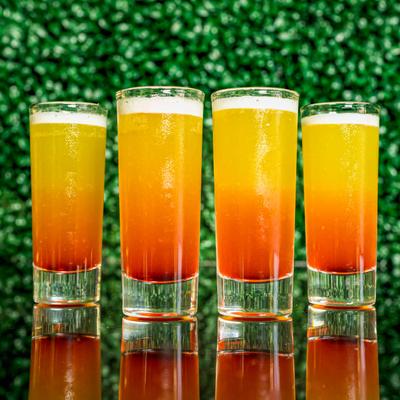 The LMP cocktail glasses, orange colored cocktail.
