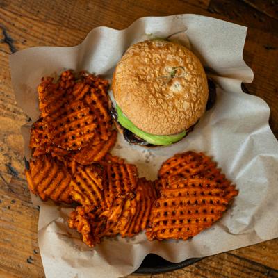Mushroom Avo Cheeseburger served with waffle fries.