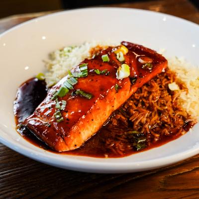 Pan-seared salmon served with basmati rice.