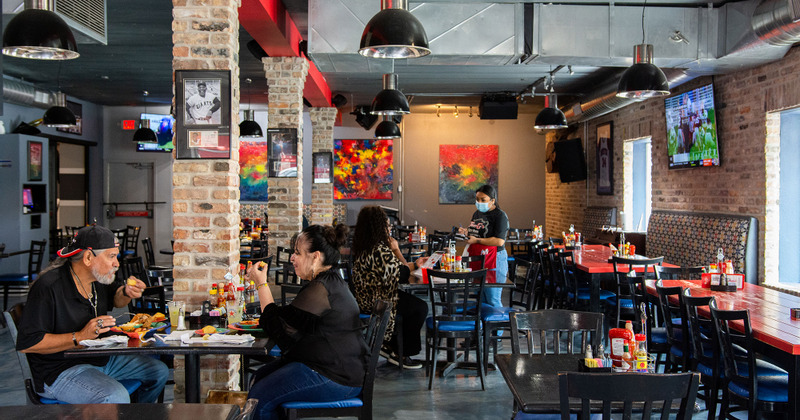 Interior, guests enjoying food in the dining area