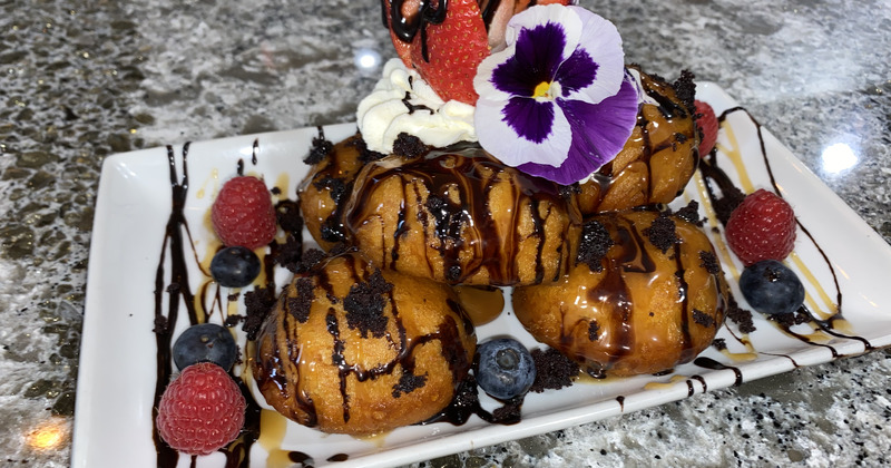 a chocolate dessert with strawberries on a plate